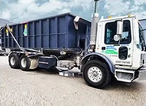 A large truck is parked on the side of the road.